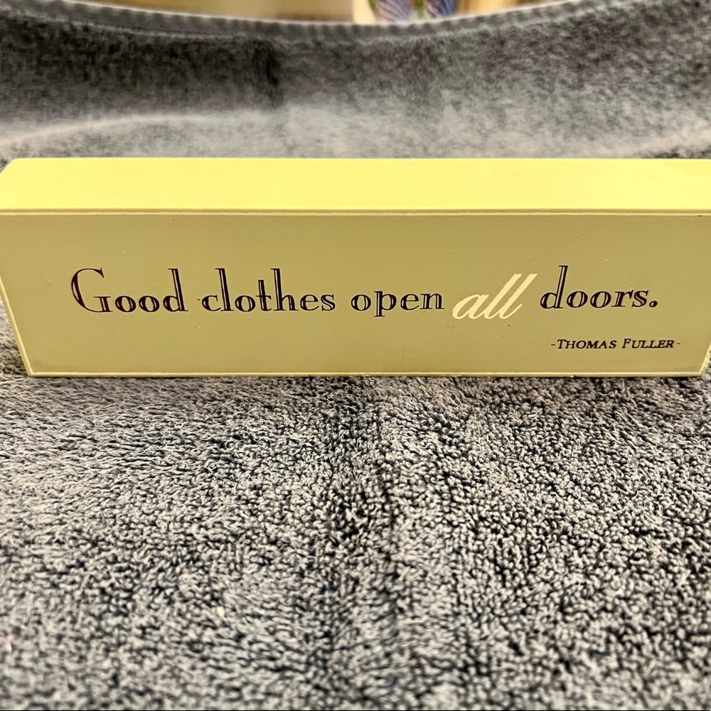 Decorative Wooden Sign: Good clothes open all doors. -Thomas Fuller